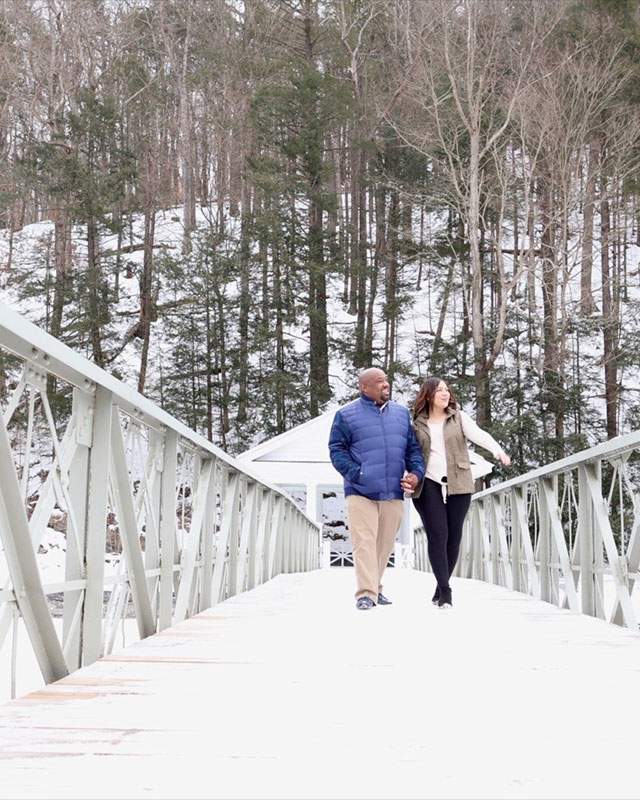 couple walking on a bridge in Winter
