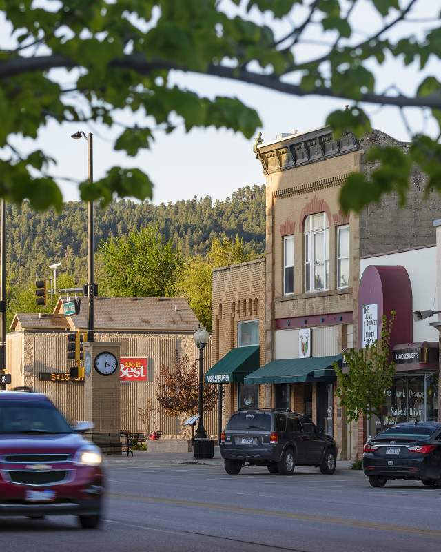 A car driving down Main Street in Spearfish
