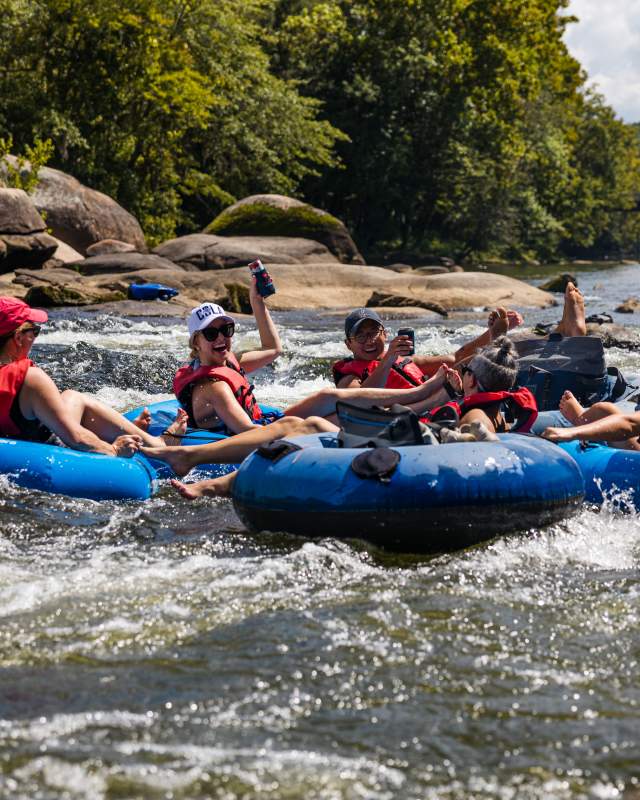 Young adults tube down the rivers in Columbia SC