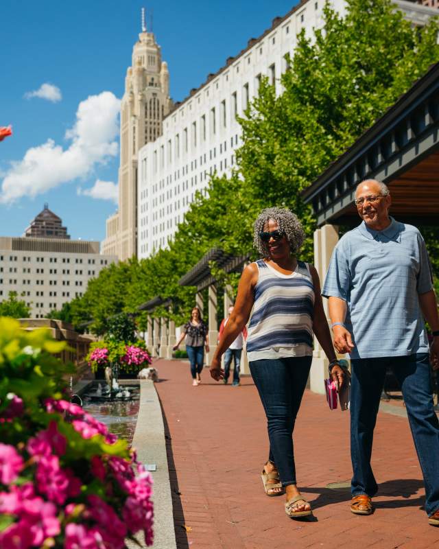 Black woman and white man walking on Scioto Mile