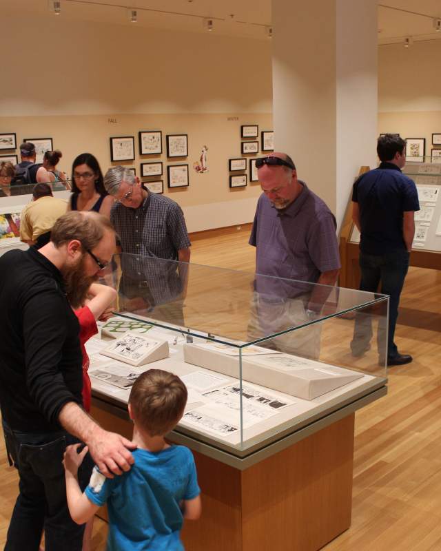 People at an exhibition at the Billy Ireland Cartoon Museum