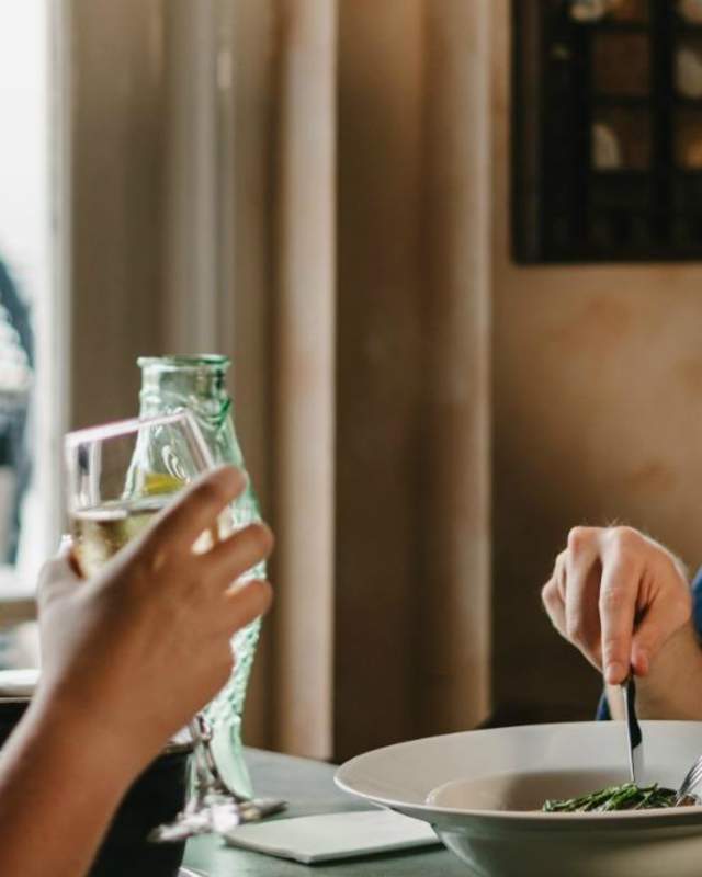Man and woman eating in a bistro