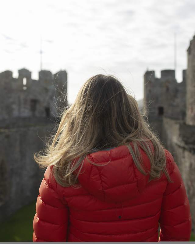 Woman looking out over Conwy Castle