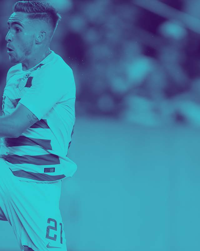 A banner image featuring a soccer player kicking a ball in the background.