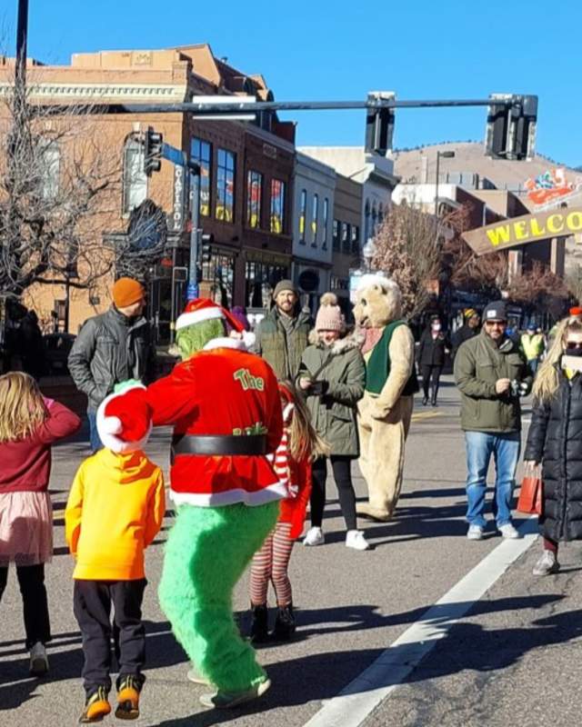 Holiday Characters and families share the holiday season by gathering on Washington Avenue, Golden Colorado's main street.