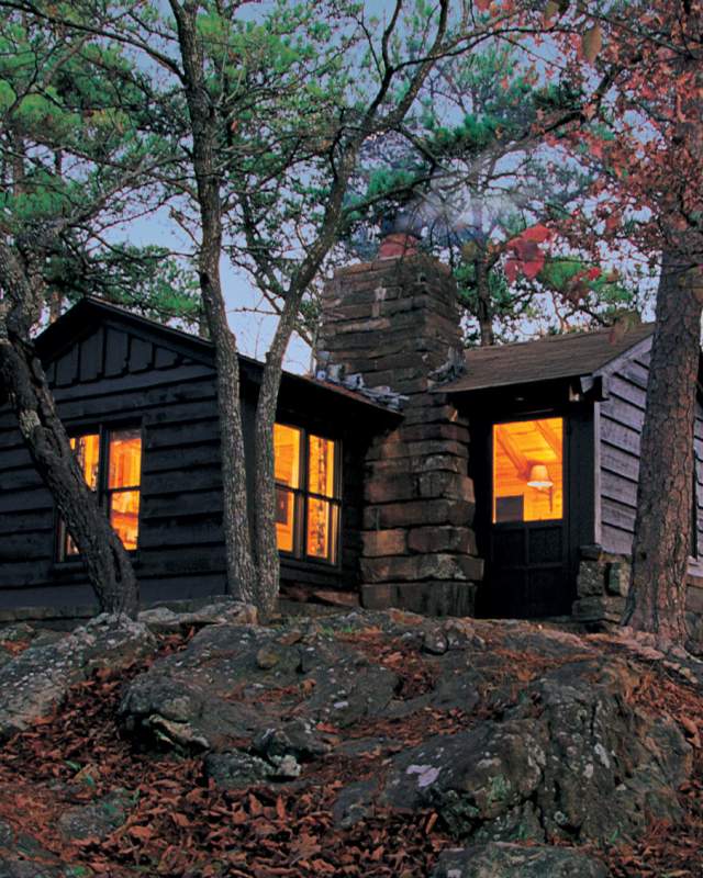 Cabin atop a hill in the woods
