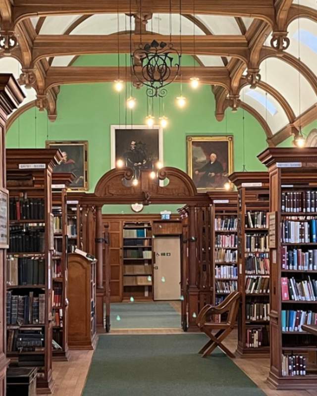 Old Cambridge College library with apple green walls
