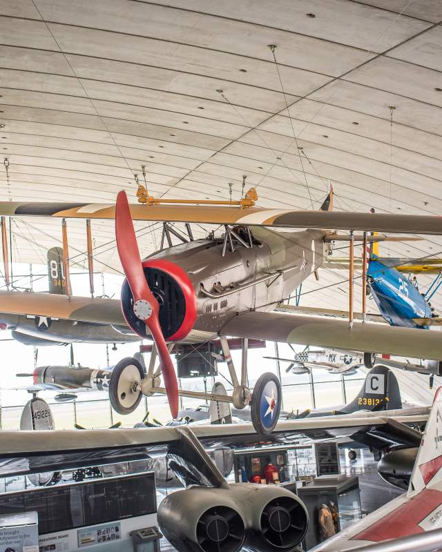 Airplanes hanging in hanger at IWM Duxford