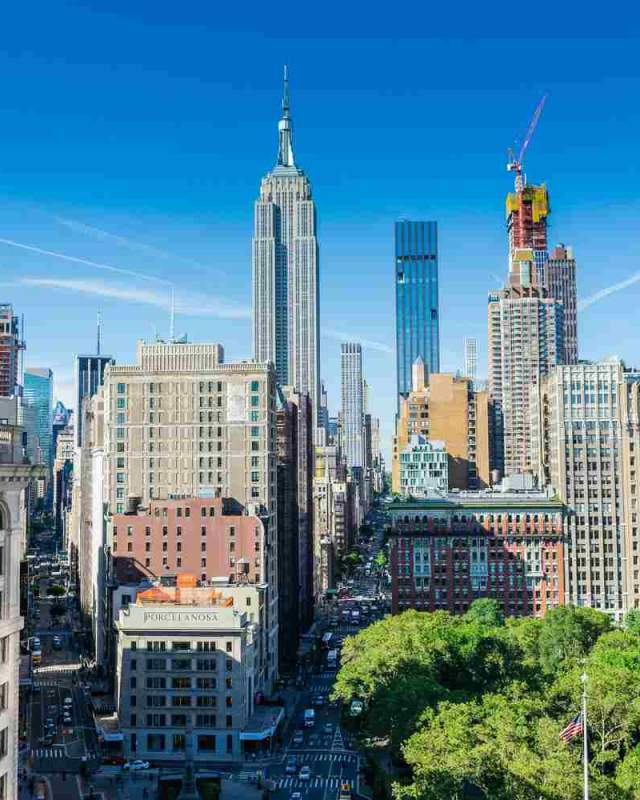 High-angle view looking at a variety of New York City skyscrapers, capturing the kind of architectural detail.