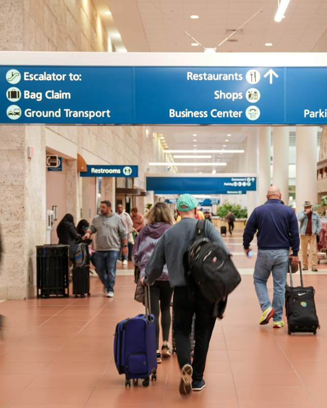Passengers walking in the main terminal.