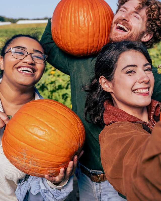 Taking selfie with pumpkins