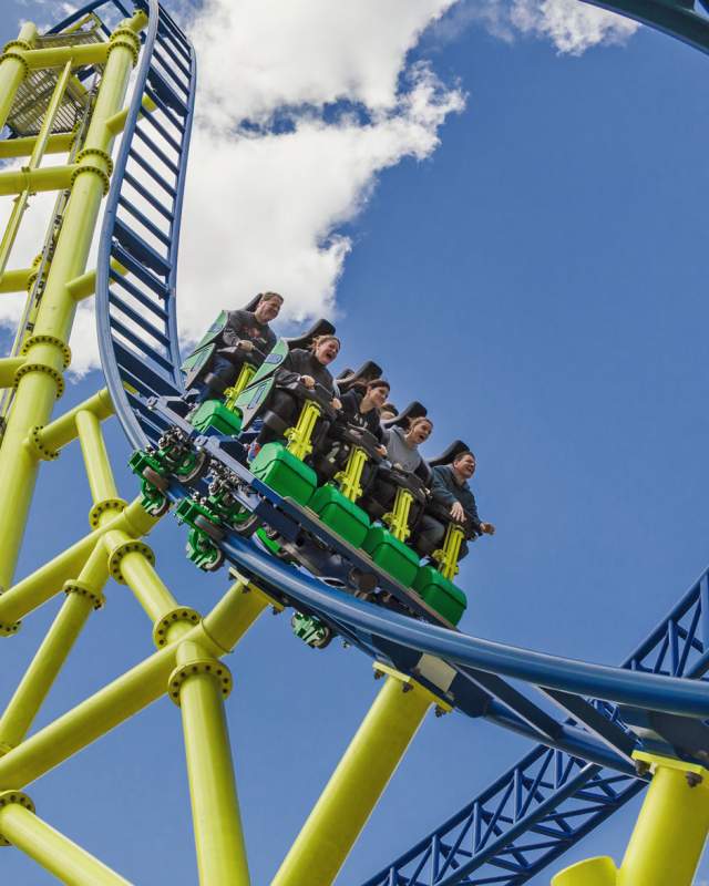 People riding a roller coaster