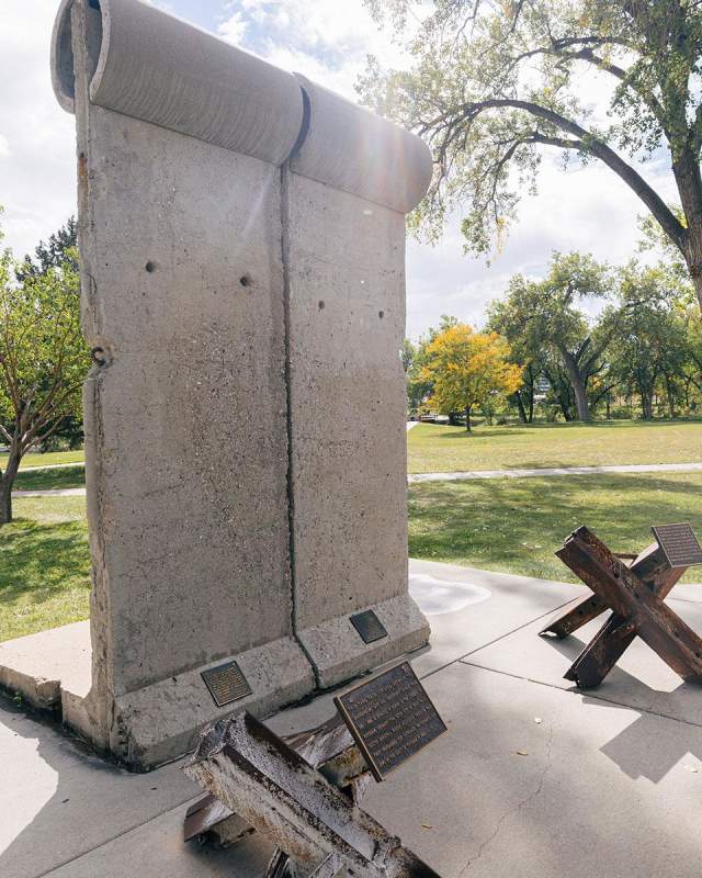 pieces of the berlin wall and tank traps that are found in memorial park in rapid city south dakota