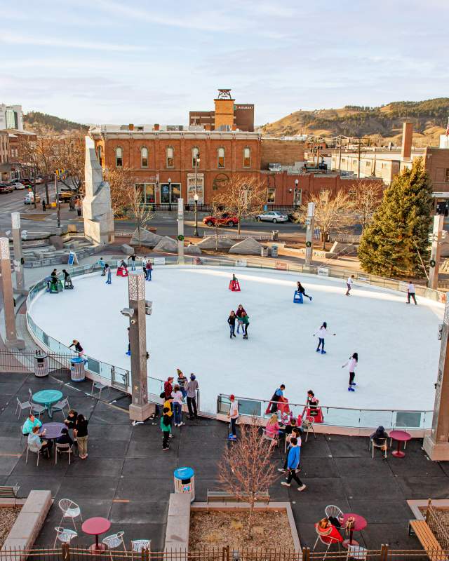 birds eye view of the main street square ice skating rink with skaters in rapid city, sd