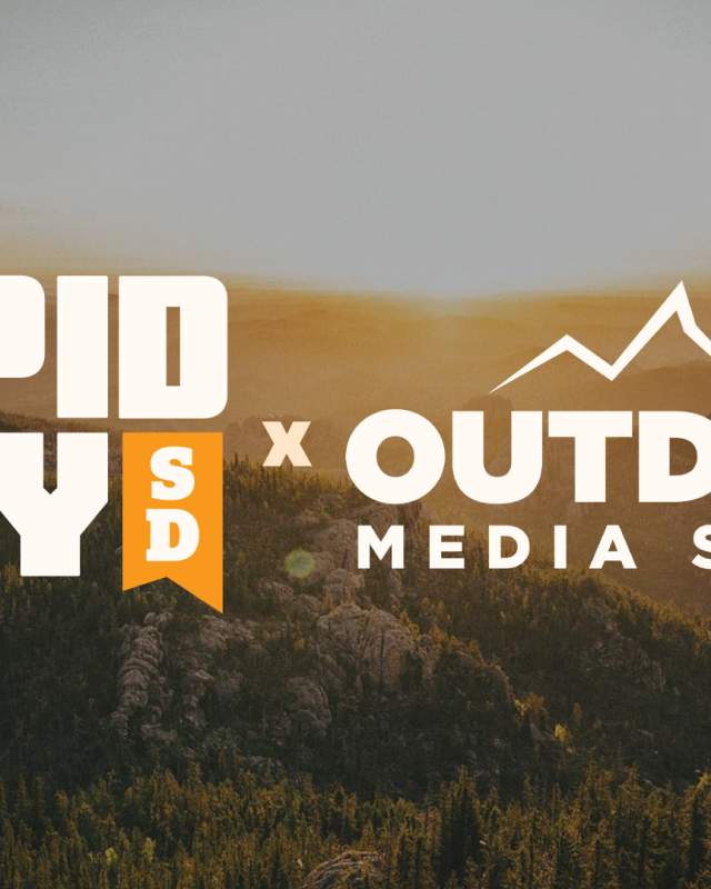An artistic image featuring the logos of Visit Rapid City and Outdoor Media Summit over a photo of a the Black Hills at sunset.