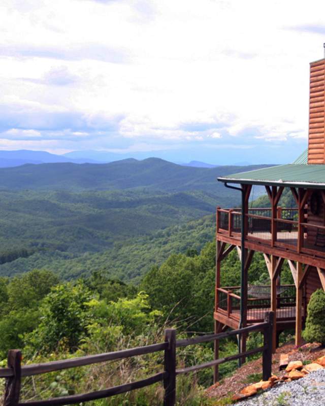 An impressive cabin overlooks forested mountains near Bostic, NC.