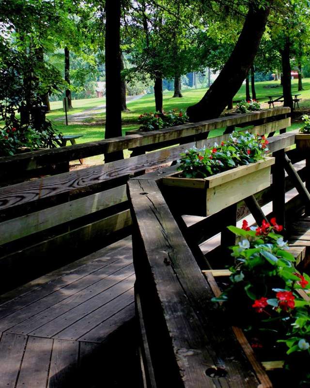 A raised walkway with planters at Kiwanis Park in Rutherford, NC