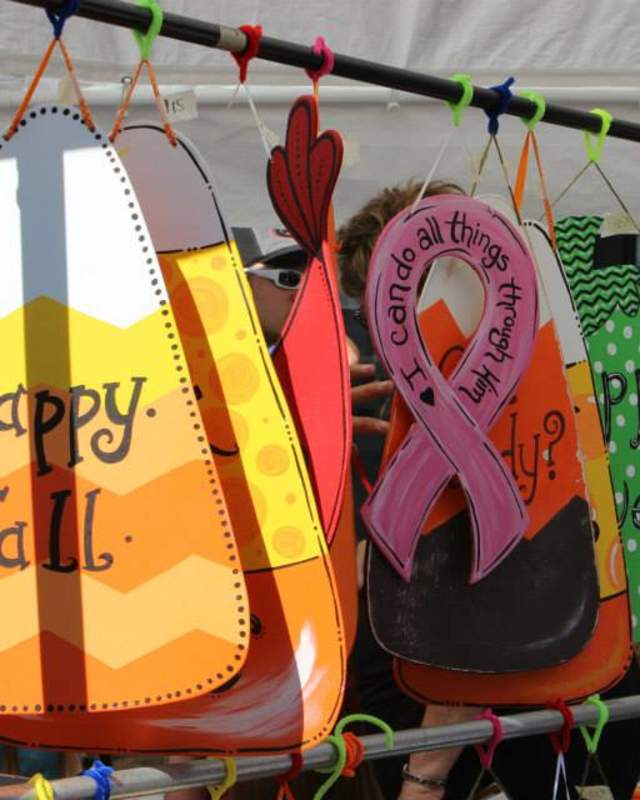 A clothing rack with fun fall-inspired crafted creations at a vendor at the Hilltop Fall Festival in Rutherford County.