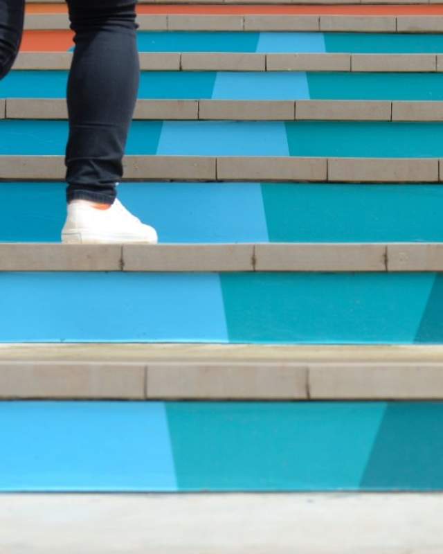 Person going up steps