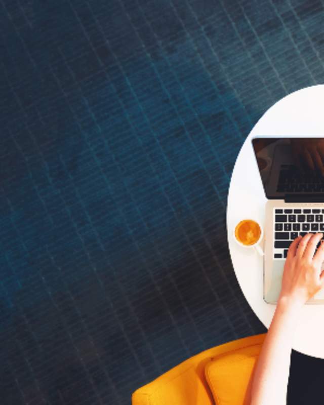 overhead person using laptop