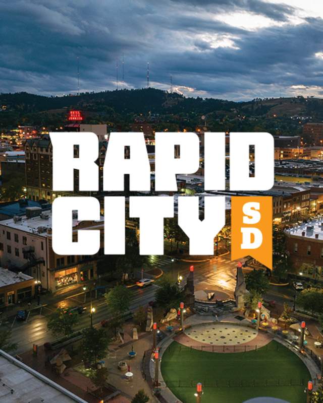Visit Rapid City 2024 Visual Identity Logo overlaying an image of Rapid City South Dakota