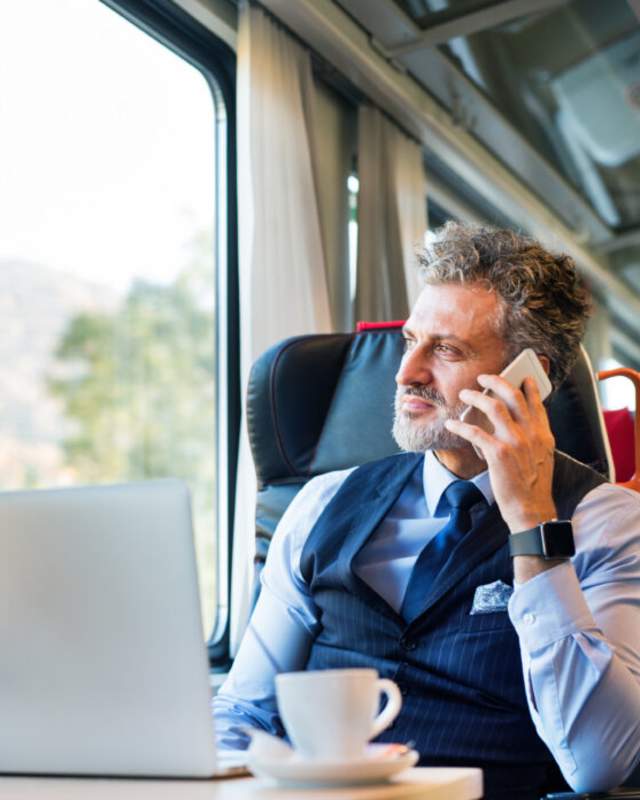 Man using phone on train