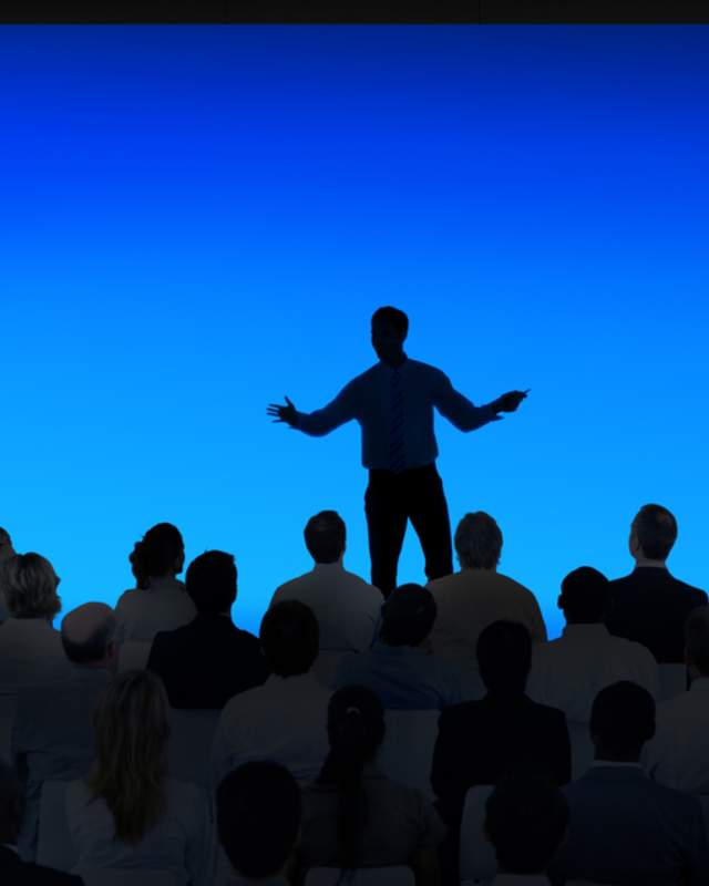 Person speaking to audience