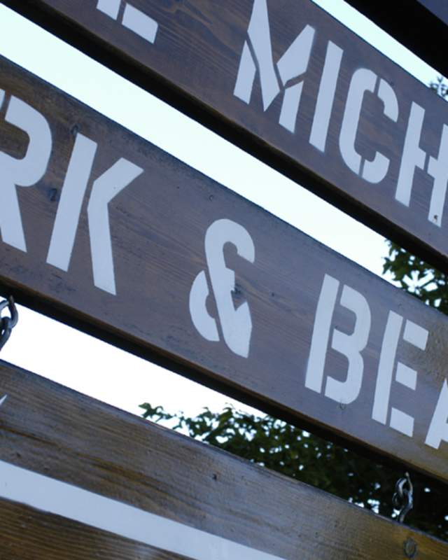 A close-up of a park sign
