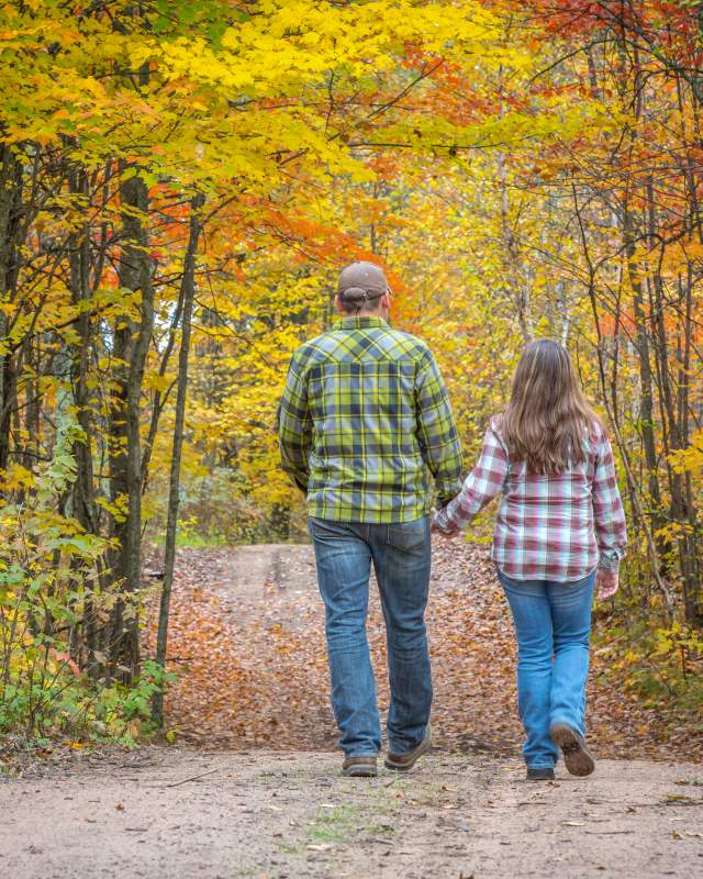 Couple hiking on a fall color trail