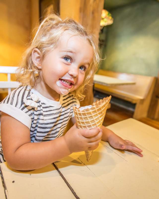 little girl eating an ice cream cone