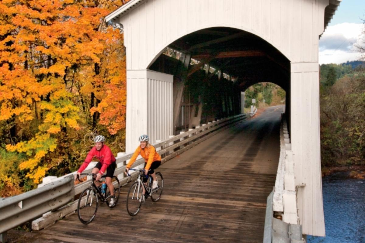 Mosby Covered Bridge Cycling in Fall by David Bassett