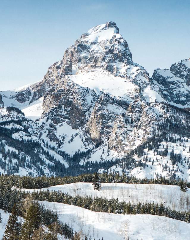 Grand Tetons with snow and blue skies