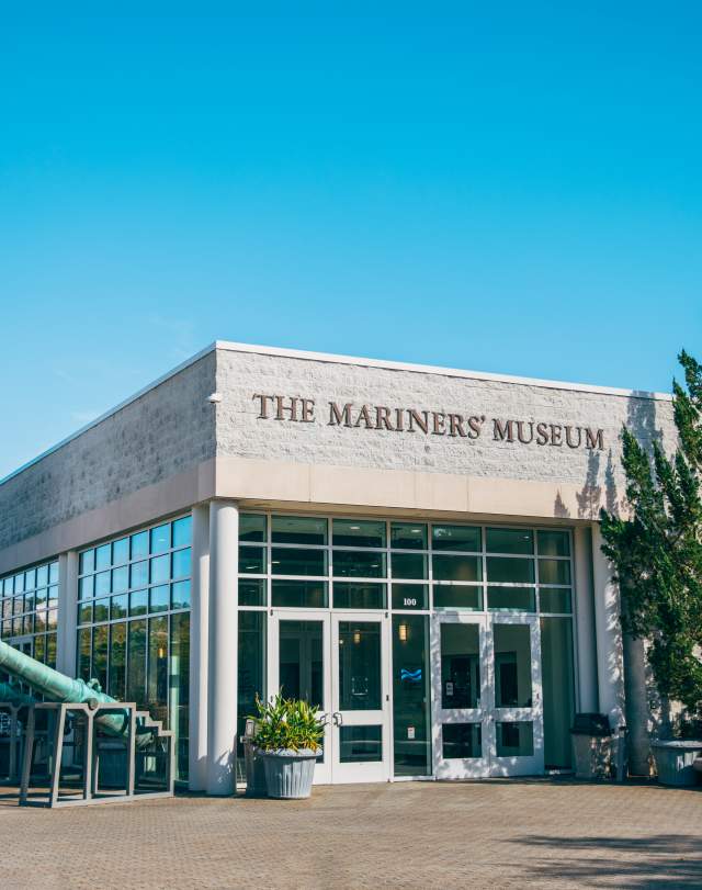 The Mariners' Museum entrance featuring a wind vane with a ship
