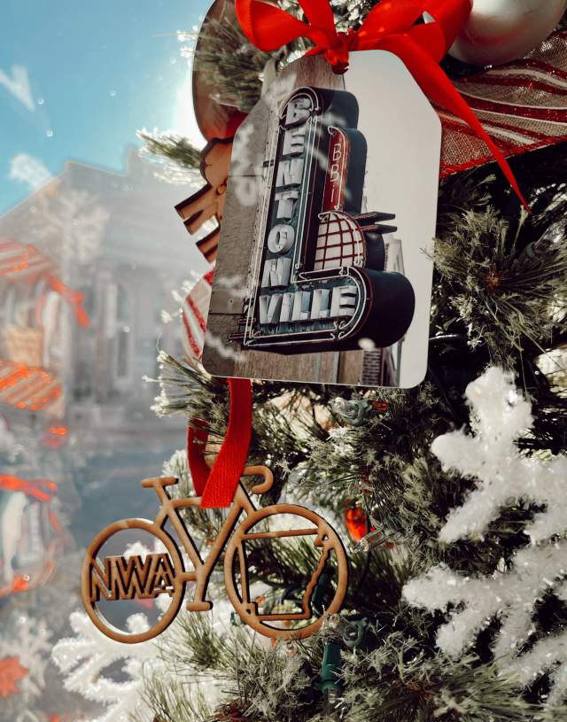 Bentonville themed ornaments on a Christmas tree - a bike and a Bentonville sign.