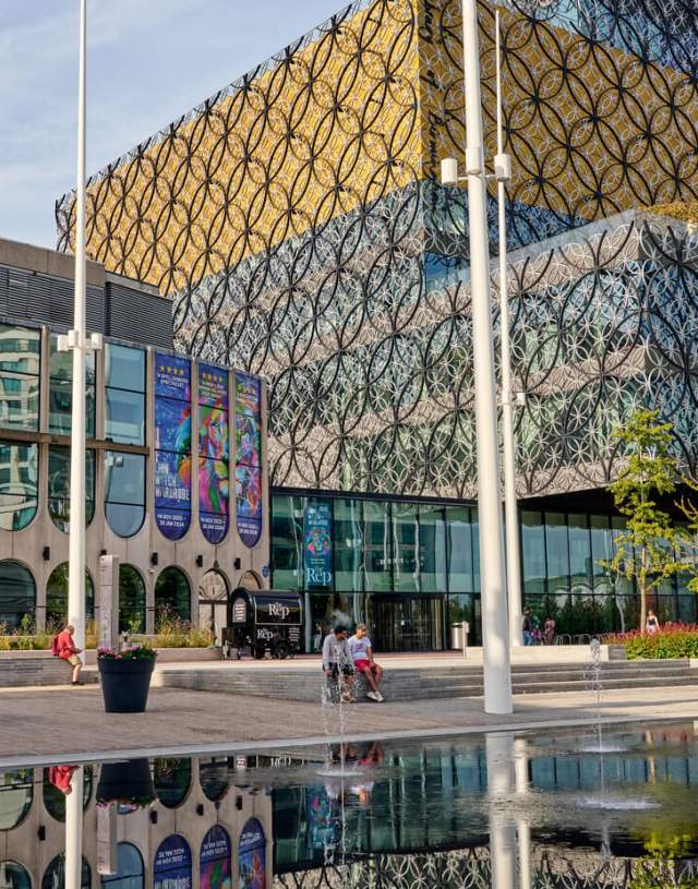 Outside of Birmingham Repertory Theatre; a glazed exterior with large lettering above saying 'the Rep'.