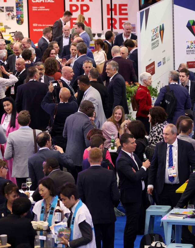 People chatting at an exhibition