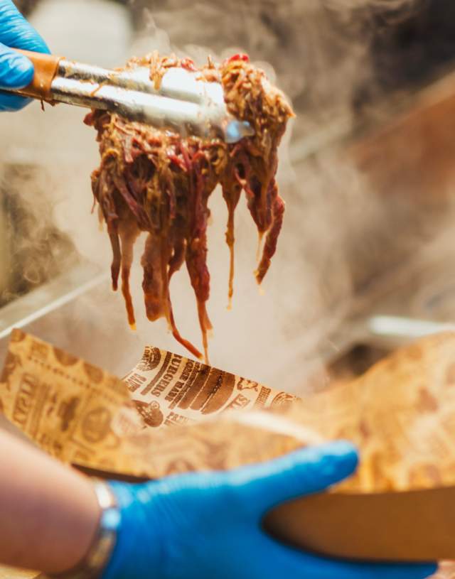 Someone making up a carvery sandwich at the Beverley Festival of Christmas