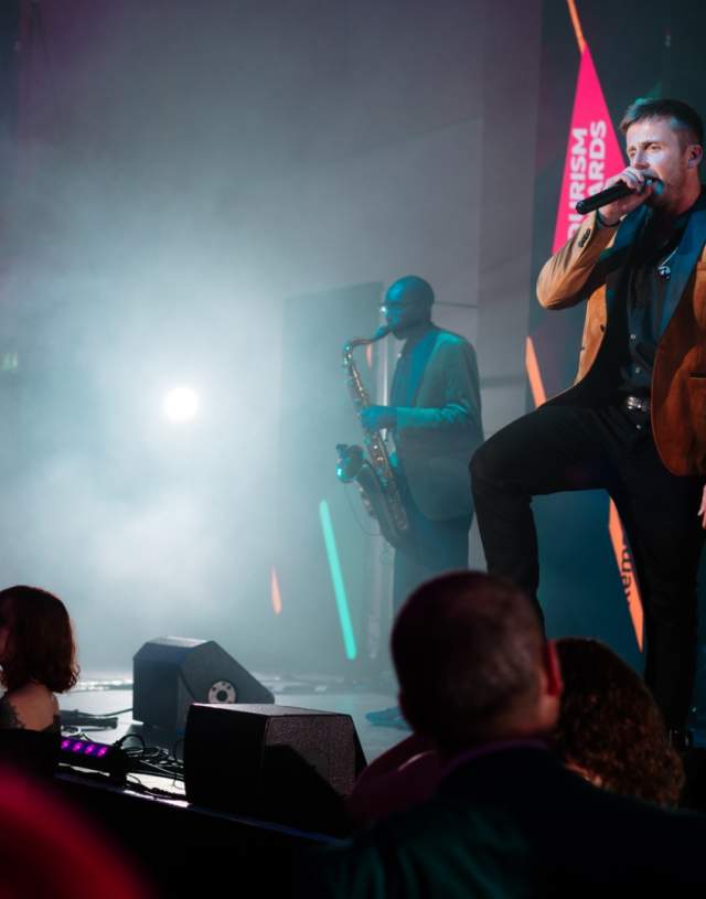 Singer and saxophonist performing at the REYTAs 2024