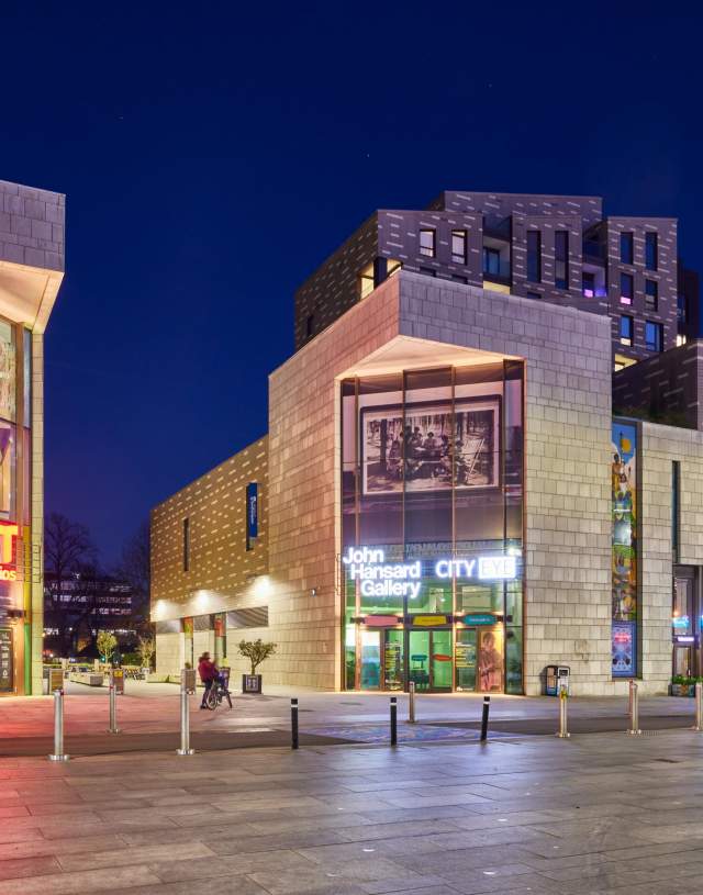 The cultural quarter at night showing John Hansard Gallery and Mayflower Studios buildings with signage lit up