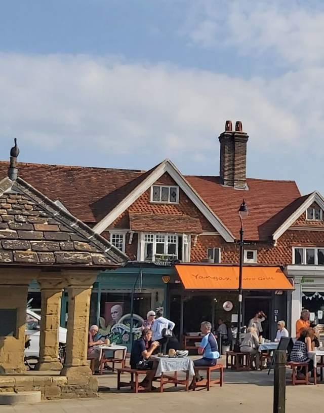 Cranleigh High Street with people enjoying outdoor dining