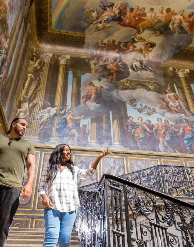 Visitors enjoy the interior of Hampton Court Palace