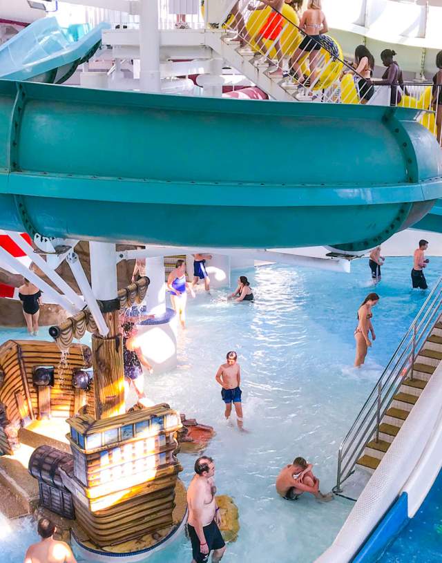 Swimming pool with slides and families at Guildford Spectrum