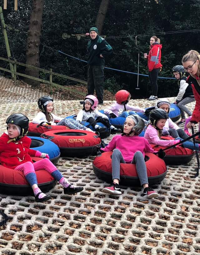 Children sitting in rubber rings at Sandown Sports