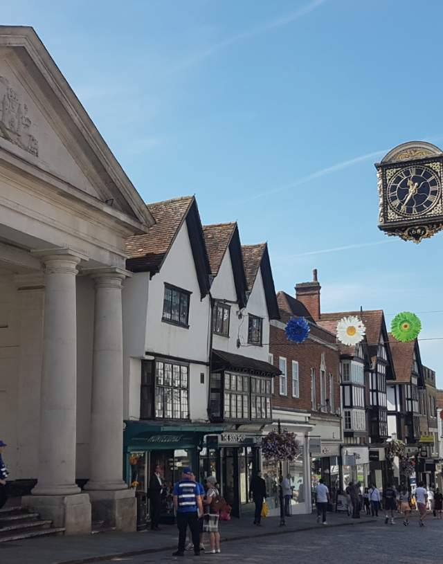 Guildford High Street with clock and Tunsgate Arch
