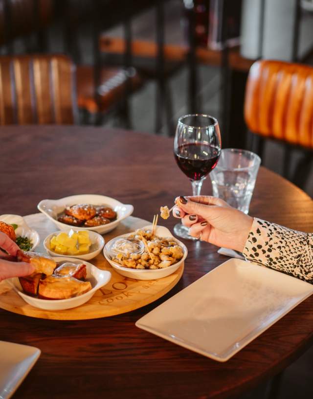 Couple enjoying tapas and wine