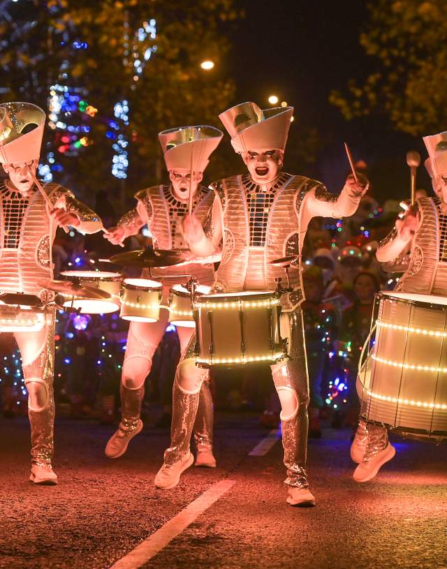 Light up drummers marching along the Swansea Christmas Parade