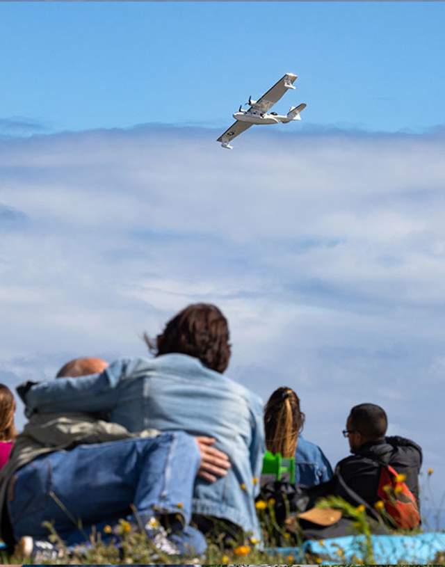 Couple hugging while watching the wales airshow