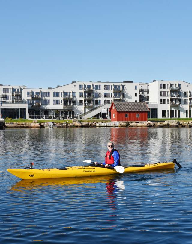 Woman kayaking at Lindesnes Havhotell