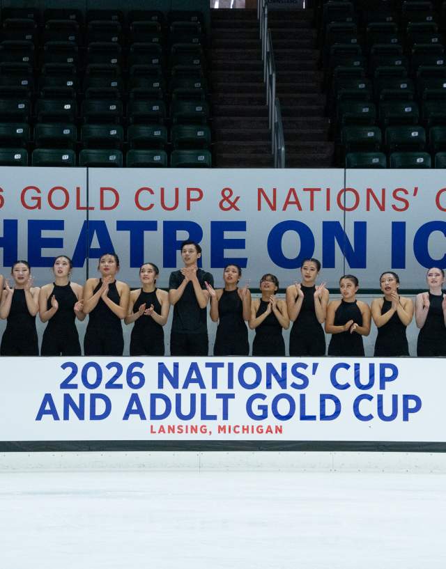 A team photo with the 2026 Gold Cup & Nations' Cup Theatre on Ice banner.