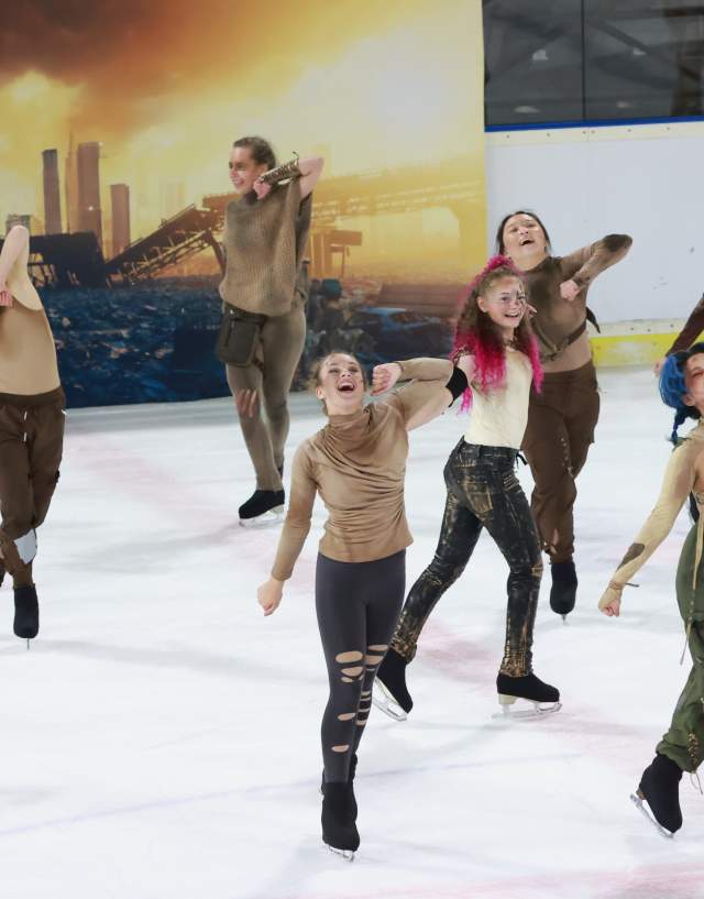 A group of skaters on the ice